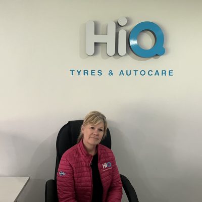 Hi Q Tyres Autocare Livingston Staff under Hi Q Sign