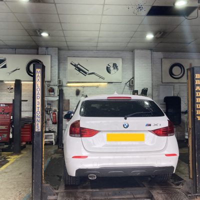 Hi Q Tyres Autocare Truro Marketing Team Visit May 22 Car being worked on