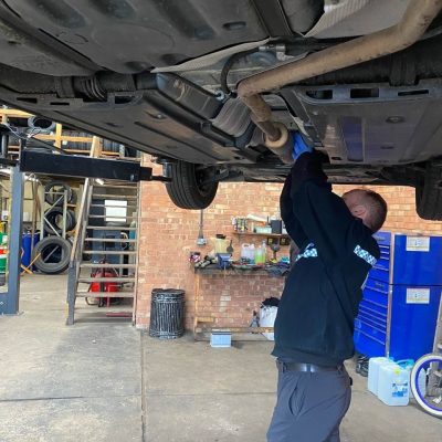 Fitter beneath Car
