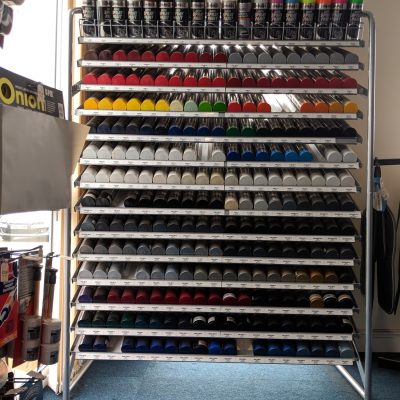 HiQ Ruthin spray paint cans on sale in the shop.