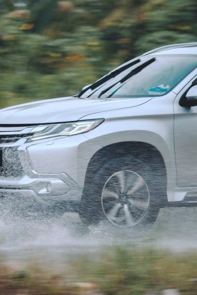 Silver Mitsubishi driving through the water