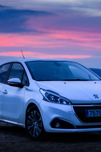 Silver Peugeot with Sunset
