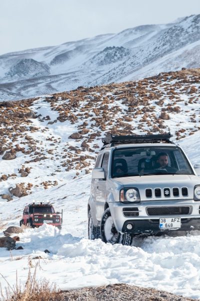White suzuki in the snow