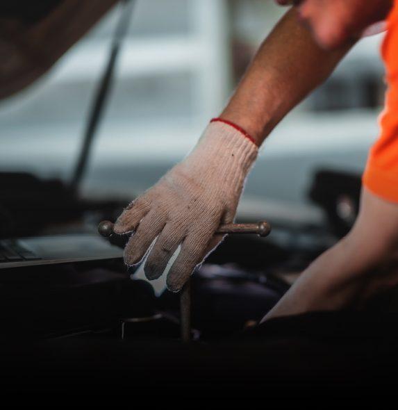 Technicians working on engine
